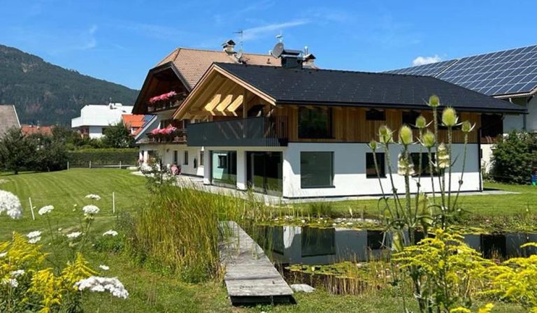 a house with a pond in the front